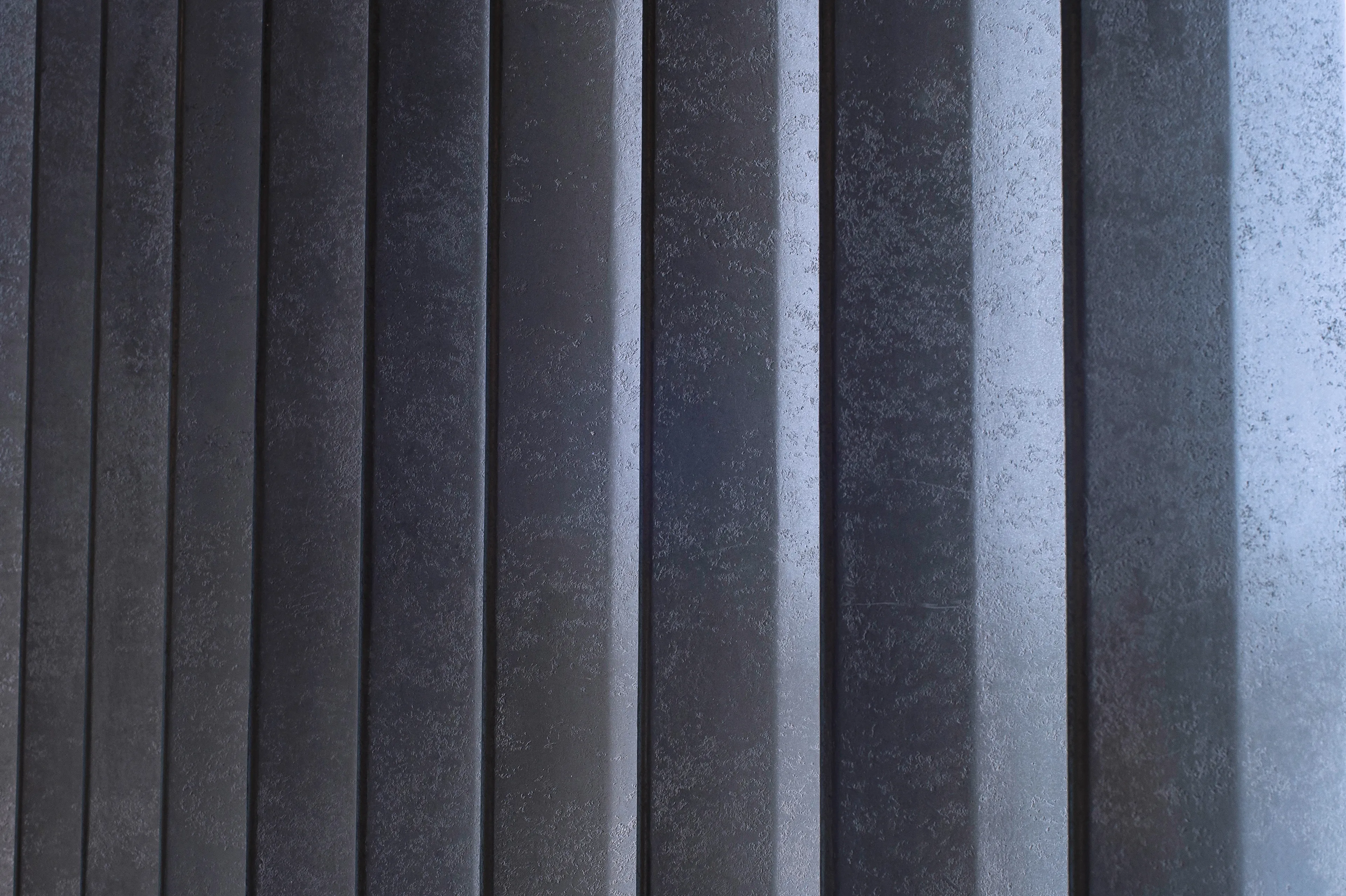 Close view of the ribbed wall finish and its narrow vertical edges
